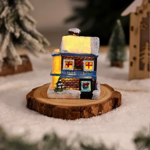 GIFT SHOP miniature glowing resin Christmas house with faux snow and warm LED lights