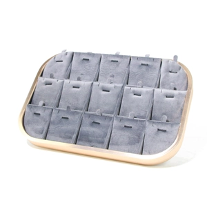 Detailed display of 15-slot gray velvet jewelry tray with a gold metal frame for necklaces