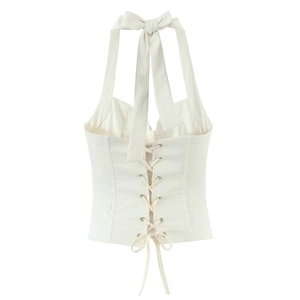 White halter neck corset top with lace-up back and boning detail on white background