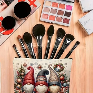 Christmas gnome makeup bag set with brushes on a stylish light wood tabletop background