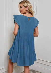 Detail of the layered ruffle hem and back design on the blue short summer dress