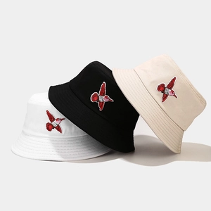 Unisex embroidered hummingbird bucket hats in black, white, and khaki for sun protection