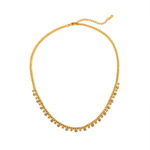 Detailed view of gold Cuban chain necklace with rhinestones and beads on white background