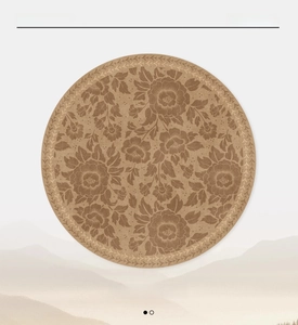 Detail of a vintage floral round rug in Pine Haze finish with available S to XXL sizes
