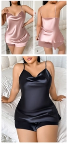 Detail of plus size silk satin pajama set featuring loose camisole and shorts in pink and black