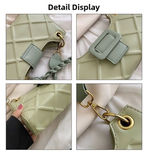 Detail of light green quilted shoulder bag with golden hardware and braided handle