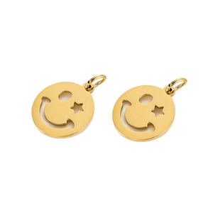 Macro shot of two golden smiling face pendants with hollow star and circle eye details