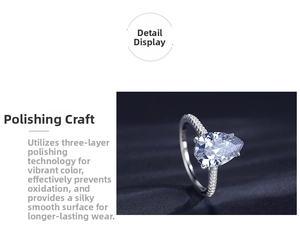 Detail of 925 sterling silver ring with pear-cut stone and micro-pave setting on velvet
