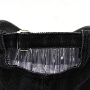 Detail of vintage black washed cotton baseball cap with adjustable metal buckle strap
