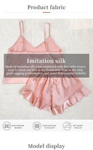 Detailed view of pink silk-like pajamas set including camisole top and ruffled shorts