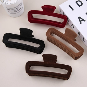 Set of four large flocked hair claws in burgundy, black, camel, and deep coffee colors