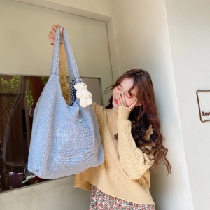 Light blue plush tote bag with bear embroidery and white fluffy charm for students