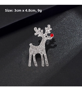 Detail of silver reindeer brooch with white crystals and red nose, size 3cm x 4.8cm