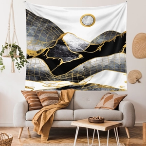 Detailed view of abstract mountain tapestry with gold lines hanging in modern living room