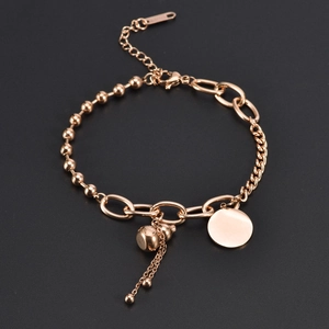 Elegante bracciale in acciaio al titanio oro rosa con ciondolo a zucca e campanellini