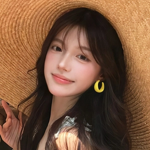 Elegant yellow round acrylic geometric hoop earrings worn with a wide straw hat