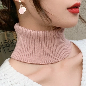 Pink rib-knit cashmere neck warmer and high collar fake scarf shown on a female model