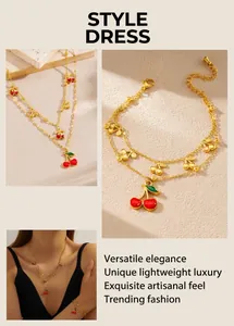 Detail view of gold cherry jewelry set including double-layered necklaces and bracelets