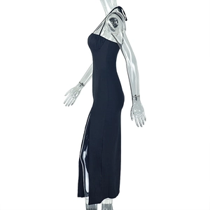 Side view of black slim-fit maxi dress featuring halter neck and high side split detail