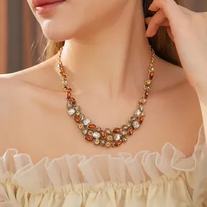 Vintage gold teardrop necklace with amber and clear crystals for a luxurious royal style