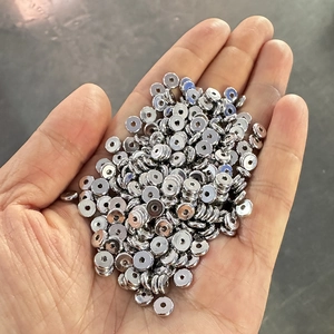 Polished silver stainless steel spacer beads for DIY jewelry making shown in hand