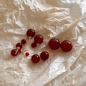 S925 sterling silver red agate bead stud earrings in various sizes on neutral paper
