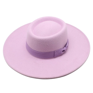 Detail of the purple wool felt jazz hat showing the satin ribbon and elegant bow knot