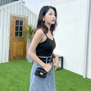 Mini black jelly crossbody bag with quilted diamond pattern and gold chain strap