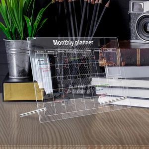 Acrylic monthly planner desk board with metal stand and stylish handwritten goals notes