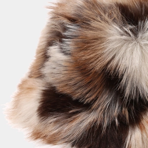 Macro shot showing the soft texture and brown fluffy fur details of the winter bucket hat