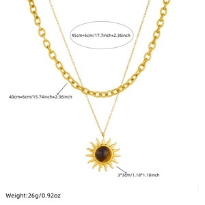 Gold layered punk chain necklace featuring sun pendant with tiger eye stone accent