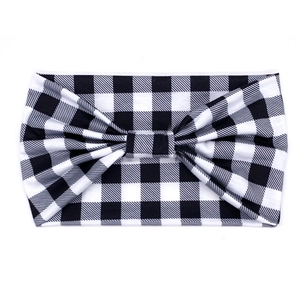 Detail of black and white buffalo plaid headband with a stylish bow decoration