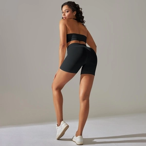 Close-up of black ribbed seamless yoga set showing texture and compression fit