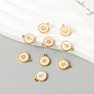 Golden round pendants with heart, star, and cross shell inlay on white wave background