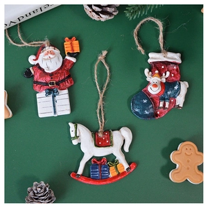 Retro Christmas tree hanging ornaments featuring Santa, reindeer, and rocking horse detail