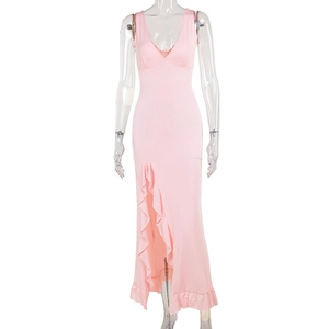 Detail of pink slim fit maxi dress with deep V-neck ruffled hem and side high slit design