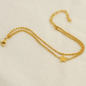 Élégant collier double épaisseur étoile dorée avec chaîne à billes et maillons sur tissu