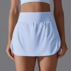 Close-up of light blue high-waisted tennis skirt with curved hem and wide waistband