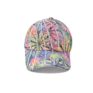 Detail of colorful leaf print baseball cap with vertical rhinestones and star studs