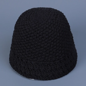 Close-up of black crochet knit bucket hat showing vintage woven texture and round top