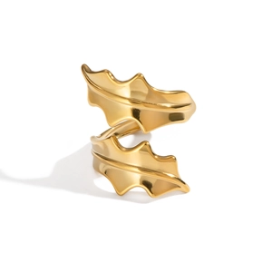 Close-up of golden seaweed leaf ring featuring a double-layered entwined geometric design