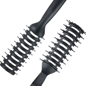 Professional anti-static black vent hair brushes for men in a minimalist top-down view