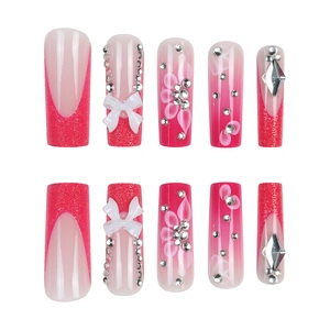 Pink gradient long coffin press-on nails with white 3D bows, crystals and flower art