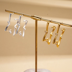 18K gold plated zircon starburst stud earrings in gold and silver finishes
