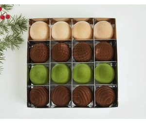 Detailed top view of 16 assorted flocked Christmas baubles in a silver gift box