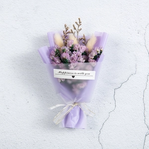 Close-up of small purple dried flower bouquet with Happiness is with you gift tag