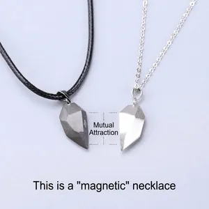Magnetic couples necklace set with two matching half-heart pendants and magnetic attraction