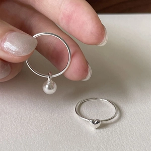 925 sterling silver ring set featuring a white pearl pendant and minimalist heart design