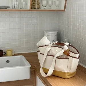 Large canvas diaper bag with multi-pockets and leather trim for baby essentials