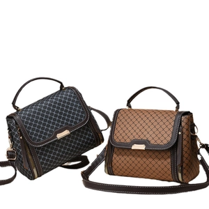 Fashionable crossbody handbags with geometric patterns and golden metal hardware detail
